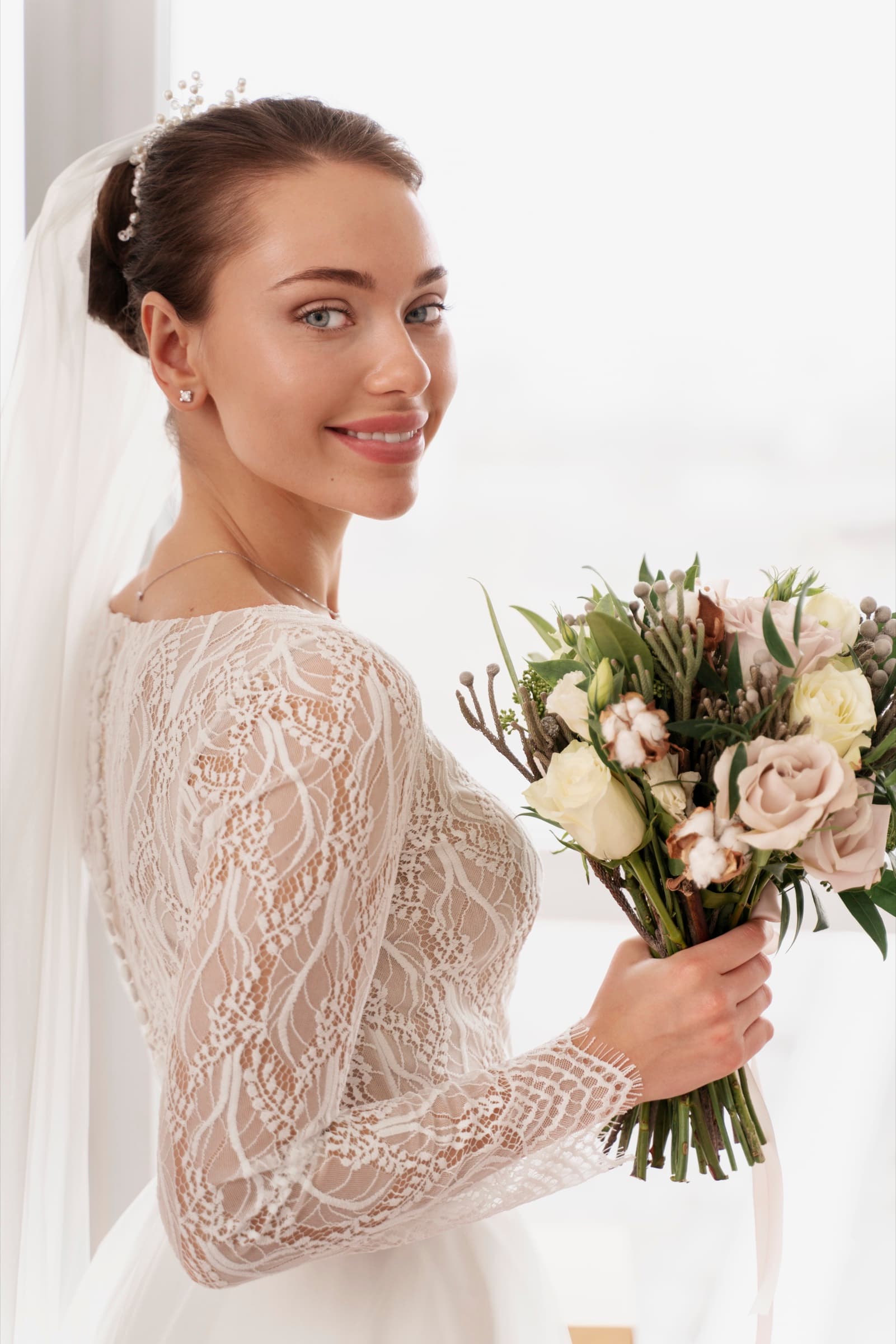 Bride preparing in soft natural daylight with luminous skin